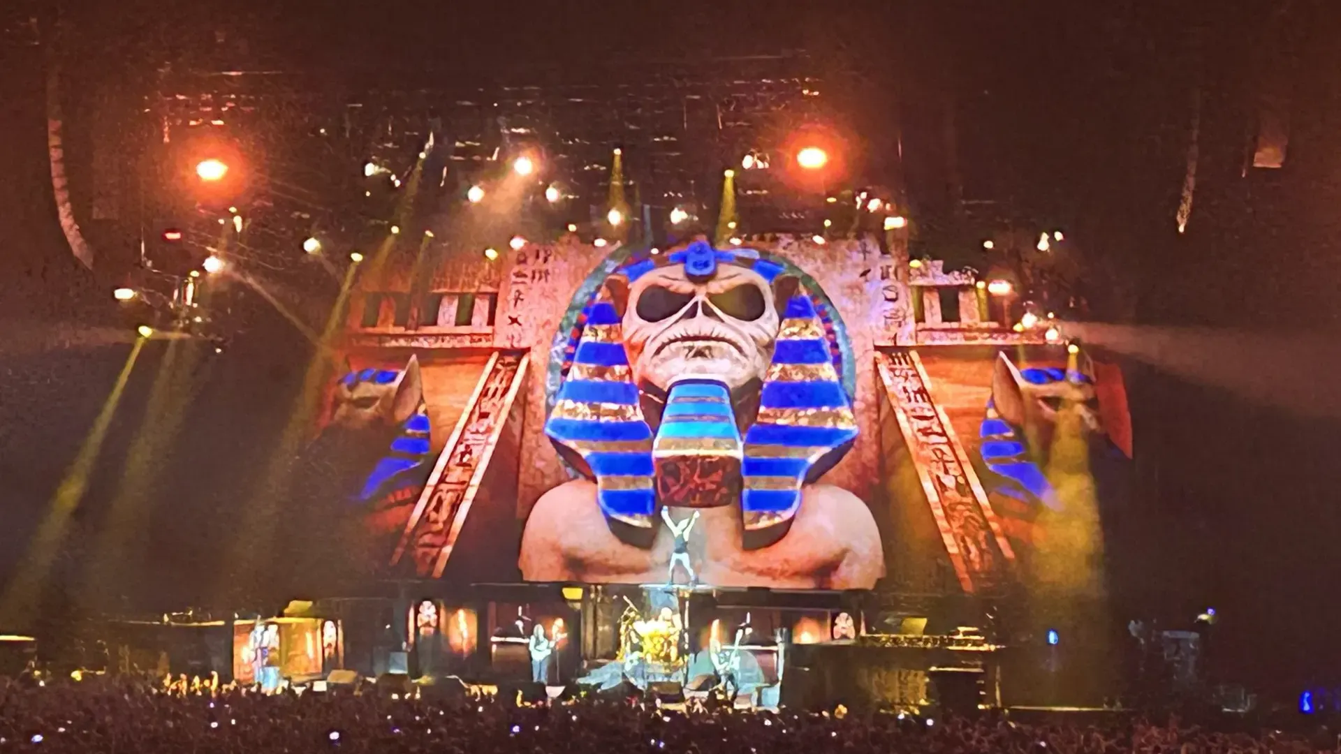 Iron Maiden performing Powerslave at Paris La Defense Arena beneath a giant pharaoh-headed Eddie stage set in July 2025