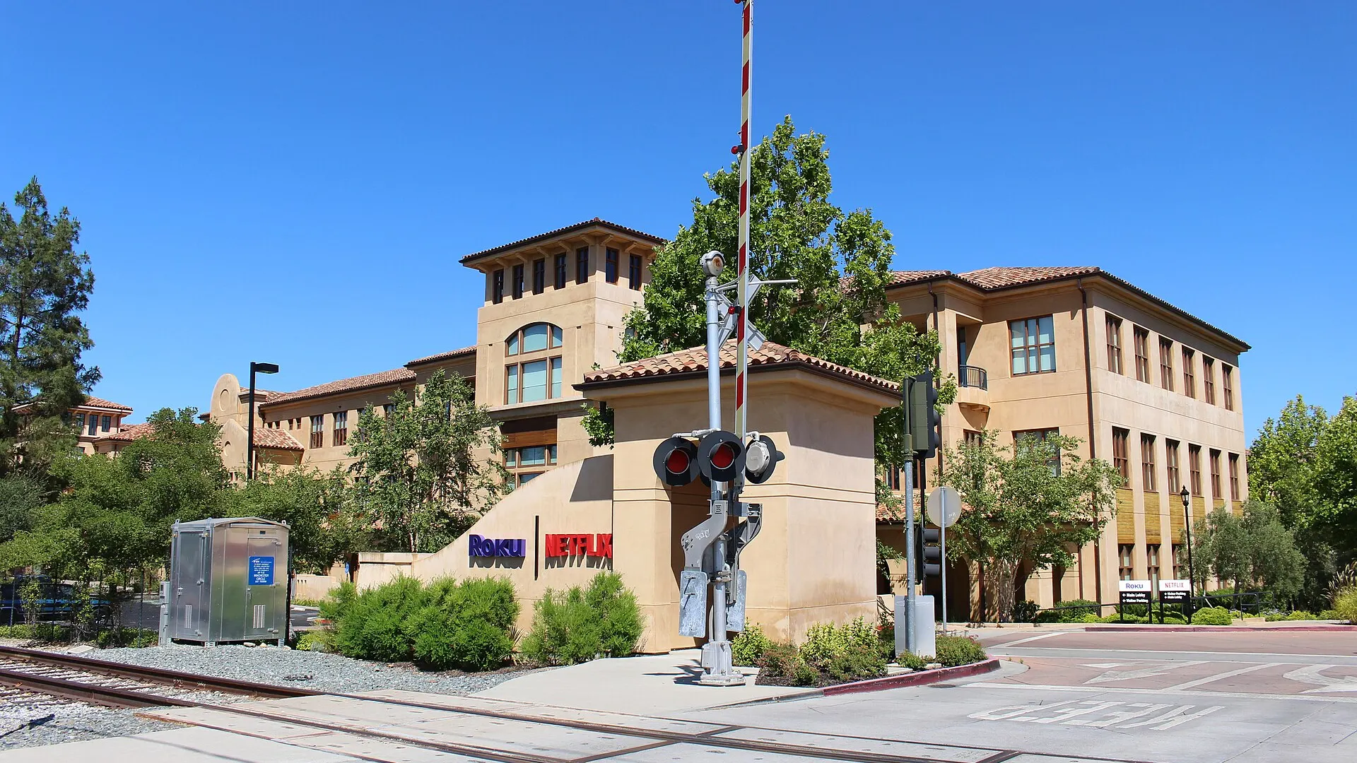 A low-rise office building with glass windows and landscaped grounds at 100 Winchester Circle in Los Gatos, California